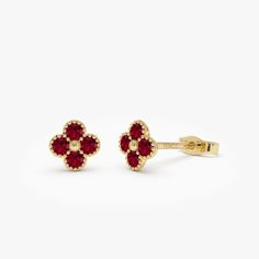 Enhance your style with these 14K solid gold Ruby Clover Studs, showcasing delicate ruby flower clovers. These earrings bring a refined charm to your ensemble, suitable for both casual wear and formal events. They make an excellent choice for a meaningful gift, offering a vibrant and elegant addition to any jewelry collection. Features * Gold KT: 14K Solid Gold * Custom Gold Color: Rose Gold, Yellow Gold, White Gold * Length & Width: 6.45 MM x 6.45 MM * Round Ruby: 8 pcs 2.0 MM  * Total CTW: 0.35ctw * Ready to Ship in 1-2 Business Days ▶ See more of our Ruby Jewelry - https://etsy.me/3XbNleY ▶ See our storefront here - http://etsy.me/2lUcVnH  ▶ All store sections here * Diamond Rings - http://etsy.me/2lwKUl8 * Diamond Earrings - http://etsy.me/2lyqVBP * Diamond Necklace - http://etsy.me/2m Cute Stud Earrings, Clover Earrings, Gold Armband, Ruby Jewelry, Emerald Jewelry, Sapphire Jewelry, Diamond Bracelets, Gold Wedding Band, Gold Bangles