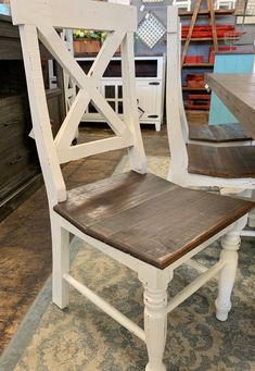 a white wooden chair sitting on top of a rug