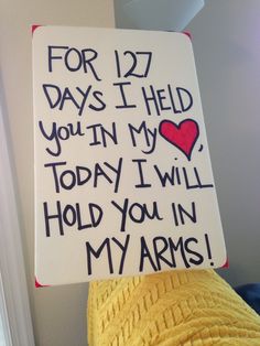 a sign that says for 122 days i held you in my today i will hold you in my arms