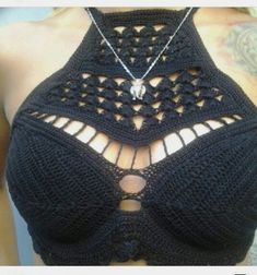 the back of a woman's bra with an openwork design on it,