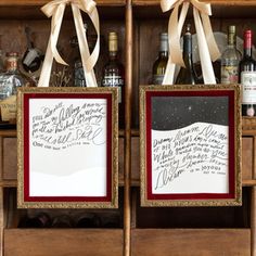 two framed pictures with wine bottles in front of wooden shelves filled with liquor and other items