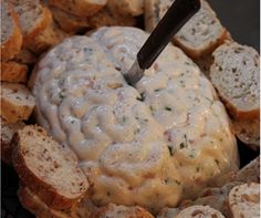 a plate filled with bread and some kind of white substance on top of it's surface