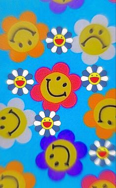 an image of flowers and smiley faces on a blue background