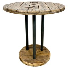 a round wooden table with metal legs