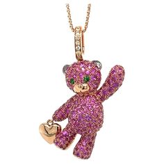 18K Gold Bear Necklace with Fancy Diamonds & Pink Sapphires 7 Fancy Diamonds 0.06 CT 2 Green Garnet 0.04 CT 202 Pink Sapphires 3.10 CT 18K Rose Gold 8.98 GM Elevate your jewelry collection with this stunning 18K gold necklace adorned with delicate pink sapphires. Add a touch of luxury and elegance to any outfit with this beautiful, high-quality necklace. The perfect gift for a loved one or a special treat for yourself, this necklace is sure to impress. With its unique design and exquisite craftsmanship, this necklace is a true work of art. Whether you're dressing up for a special occasion or simply want to add some sparkle to your everyday look, this necklace is the perfect choice. Gold Multi-stone Pink Sapphire Jewelry, Gold Jewelry With Multi-stone Pink Sapphire, Gold Multi-stone Jewelry With Pink Sapphire, Pink Sapphire Multi-stone Gold Jewelry, Luxury Rose Gold Pink Sapphire Jewelry, Luxury Pink Jewelry Collectible, Luxury Pink Collectible Jewelry, Pink Sapphire Multi-stone Jewelry For Gifts, Multi-stone Pink Sapphire Jewelry For Gifts