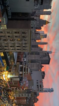 the sky is pink and orange in this cityscape