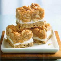 three pieces of dessert sitting on top of a white plate