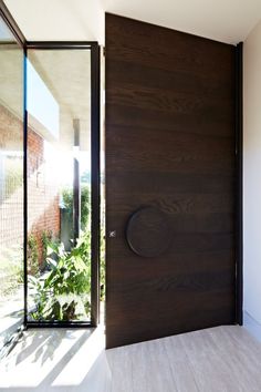 an empty room with a large wooden door