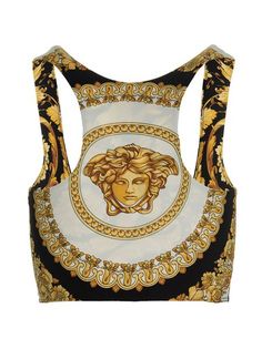 Get ready to make a statement with this stunning Baroque Printed Cotton Tank Top. The exquisite design and vibrant colors will add a touch of elegance and luxury to your wardrobe. Crafted from a lightweight cotton blend, this top is perfect for warmer weather, making it an ideal choice for outdoor activities or stylish social events. The asymmetrical design provides added coverage to the cropped silhouette, while the batwing sleeves add effortless movement to your look. The hints of pink in the Versace Baroque, Print Tank Top, Asymmetrical Design, Cotton Tank Top, Gianni Versace, Italian Luxury, Print Tank, Printed Tank Tops, Batwing Sleeve