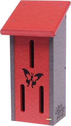 a red birdhouse with a black butterfly on it