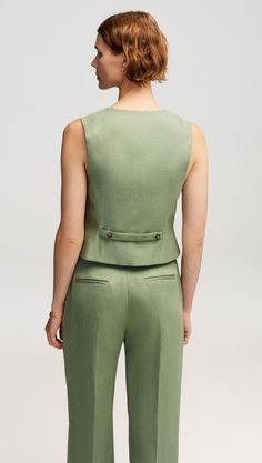 Elevate your workwear with a classic waistcoat. Designed to be worn as its own top or styled atop a blouse, our waistcoat reimagines traditional suiting for the modern working woman. The slim silhouette features functional pockets at the front, center-front button closures, and a stationary back belt. Waist Coat For Women, Suit Vest Women, Vietnam Dress, Women's Vests, Slim Vest, Latest African Men Fashion, Denim Vests, Waist Coat, Green Suit