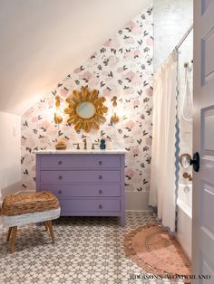 the bathroom is decorated in pastel colors