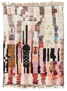 a multicolored rug with fringes on the bottom and an abstract design in black, white, pink, orange