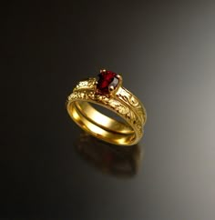 This is a beautiful Natural red Garnet. The 5 mm stone is eye clean and set in 14k Yellow Gold with 3.25mm wide by 1.5mm thick band in a vintage style floral pattern.  Garnet rates a 7 on the Mohs scale for hardness. Comes with matching 2.5mm band.  I can make this ring for you in any size between 4 and 10.  Specify your ring size at check-out. Sapphire Wedding Set, Garnet Wedding Rings, Ruby Wedding Rings, Garnet Wedding, Ruby Ring Gold, Sapphire Wedding Rings, Red Spinel, Future Engagement Rings, Stone Wedding