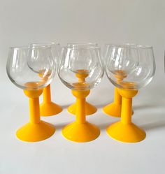 Mid Century Modern Bodum Oktett Wine Glasses | Vintage Glassware with Bold Orange Plastic Stem Beautiful set of 6 Pop Art glasses designed by Carsten Jorgensen. Stunning bright bold orange plastic stem and transparent glass chalice, what a combination! Height: 7" Top diameter: 3" Base diameter: 3 1/4 Capacity: 12oz No chips or cracks in the glass. In a very good vintage condition Wine Glasses Vintage, Mid Century Glassware, Glasses Vintage, Vintage Glassware, Wine Glasses, Century Modern, Pop Art, Mid-century Modern, Chips