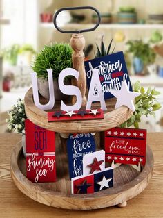 a wooden tray with patriotic decorations on it and the word usa spelled in white letters