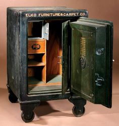 an old fashioned metal safe with the door open