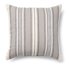 a gray and white striped pillow on a white background