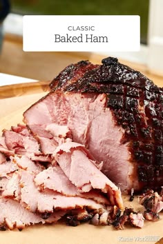 the ham is sliced up and ready to be served on the table with text overlay that reads classic baked ham