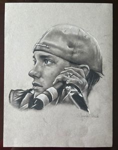 a drawing of a man with a hat and scarf on his head, holding a cell phone to his ear