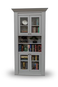 a white bookcase with many books on it