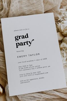 an image of a graduation party card on top of some white flowers and burlocks