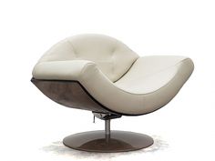 a white leather chair sitting on top of a metal base