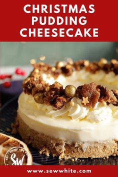 christmas pudding cheesecake with white frosting and walnuts on top, sitting on a plate