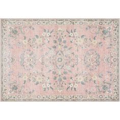 an antique pink rug with blue and green flowers on the bottom, in front of a white background