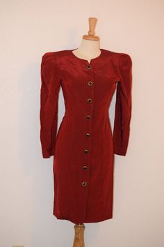 "Power dressing at its vintage best. Deep red rayon A line button front dress by 'All That Jazz' was made in California, USA and features tone on tone woven iridescent dots, gold and black buttons, wide 80's 'power shoulders' and fitted front and back seams for a wiggle dress fit. Back belt attached at seams with pleated detailing. Simple round neckline and slightly below knee styling completes the look. Shoulder pads are removable. Free of rips, stains and odor. Women's Small Measurements: Back Fall Pullover Sweaters, Red Pencil Dress, Long Sleeve Pencil Dress, 80s Party Dress, Hawaiian Print Fabric, Power Dress, Vintage Red Dress, Light Blue Tie, Vintage Tee Shirts