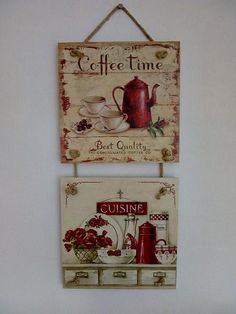 two signs hanging on the wall next to each other with cups and saucers painted on them