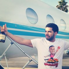 a man standing in front of an airplane