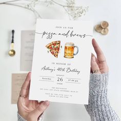 someone holding up a pizza and beer birthday card