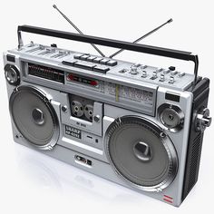 an old fashioned radio with two boomboxes on the front and one in the back