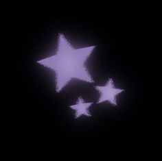 three white stars in the dark on a black background