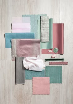 various colors of fabric laid out on top of each other with one folded in the middle