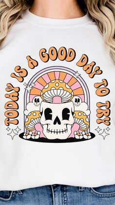 a woman wearing a white shirt that says good day