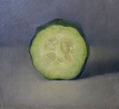 a piece of cucumber sitting on top of a table