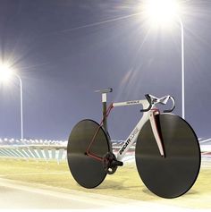 a bicycle is parked in front of some lights