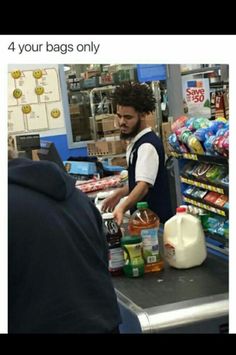 a man standing in front of a counter filled with food