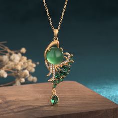 This necklace showcases the beauty of natural emerald jade stone with its peacock color and stunning design. Made from high-quality materials, it is not only a fashionable accessory but also a timeless piece that can boost your confidence and add a touch of elegance to any outfit. Elevate your style and make a statement with this exquisite necklace.

Natural Emerald Jade Stone

Pendant size:1.8*5.2cm

Chain length: 40 CM (+ 5 cm adjustable chain)

Adjustable lobster clasp size - one size fits al Jade Pendent Designs, Emerald Necklace Aesthetic, Peacock Jewelry Necklace, Vintage Necklace Antiques, Jade Jewelry Design, Fantasy Objects, Jade Accessories, Peacock Accessories, Green Jade Necklace