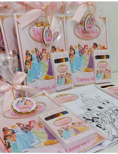 several princess themed bags with tags and stickers on them are shown in this image