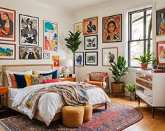 a bedroom with lots of pictures on the wall