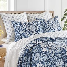 The Laure Indigo Reversible Quilt Set by Levtex Home is inspired by a beautiful country garden filled with blooming flowers . Offered in classic indigo, blue and white, this design will immediately transform your bedroom. This reversible quilt features gorgeous bright flowers in white and blue on an indigo grpund. on the front, reversing to a small blue and indigo medallion on white on the back. The Quilt and Sham have a cotton front and back, filled with a cotton-rich filler, and are machine wa Duvet Comforter Sets, Modern Cabin Interior, Indigo Quilt, Ruffle Shower Curtains, Coordinates Decor, Crib Bedding Boy, Girl Nursery Bedding, King Quilt Sets, Fall Bedding