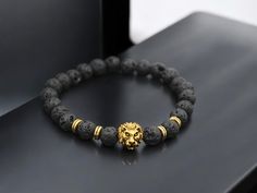 🔥🦁 Unleash your inner strength with our Lava Volcanic Stone Bracelet featuring a striking alloy lion head! This bold and fashionable bracelet combines the rugged texture of volcanic stones with the fierce lion head design, making it a powerful accessory for any man. Perfect for adding a touch of edge to your look or as a standout gift. 💪✨ 💎 Key Features: Materials: Lava Volcanic Stones, Alloy Lion Head Design: Bold and Fashionable with a Fierce Lion Accent Occasion: Ideal for Everyday Wear, Special Occasions, or as a Unique Gift 🎁 Gift Ready: A strong and stylish choice that's sure to impress! Make a statement and embrace your bold side with this distinctive bracelet! 🌟 Lion Head Bracelet, Fierce Lion, Volcanic Stone, Lion Design, Lucky Stone, Bold Jewelry, Head Design, Lion Head, Inner Strength