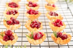 small cranberry tarts on a cooling rack