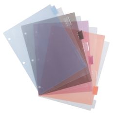 five different colored folders stacked on top of each other