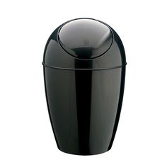 a black vase sitting on top of a white table