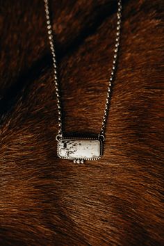 One of a kind White Buffalo + Sterling necklace. This necklace has some heft to it with gorgeous silver work! Stamped Sterling with maker's mark by E. Richards Navajo Handmade Measures approximately 3/4" tall x 1-1/2" wide Adjustable 18" chain. White Buffalo Necklace, Western Bar Necklace, Buffalo Necklace, White Buffalo Turquoise Jewelry, Spiny Oyster Turquoise, Oyster Turquoise, Western Vibes, Sterling Necklace, Barrel Racer