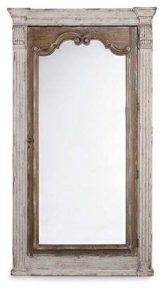 an old wooden mirror frame with carvings on the top and bottom edge, against a white background